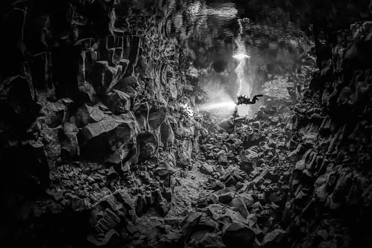 A scuba diver explores the Silfra fissure in Iceland, the tectonic boundary between the North American and Eurasian plates.