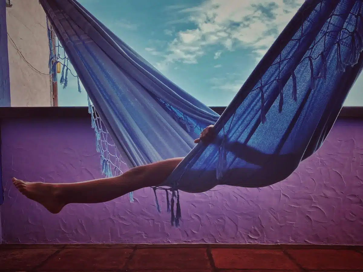 Kid sitting in a hammock