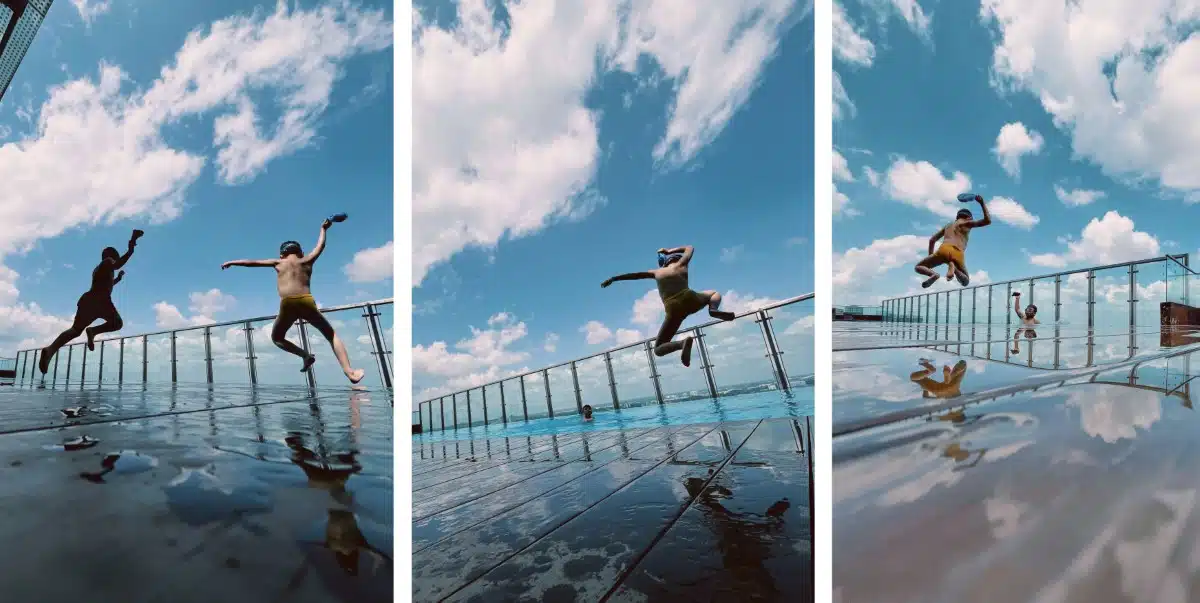 Kids jumping into a pool